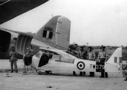Auster TW379 being loaded into a C-47 Dakota